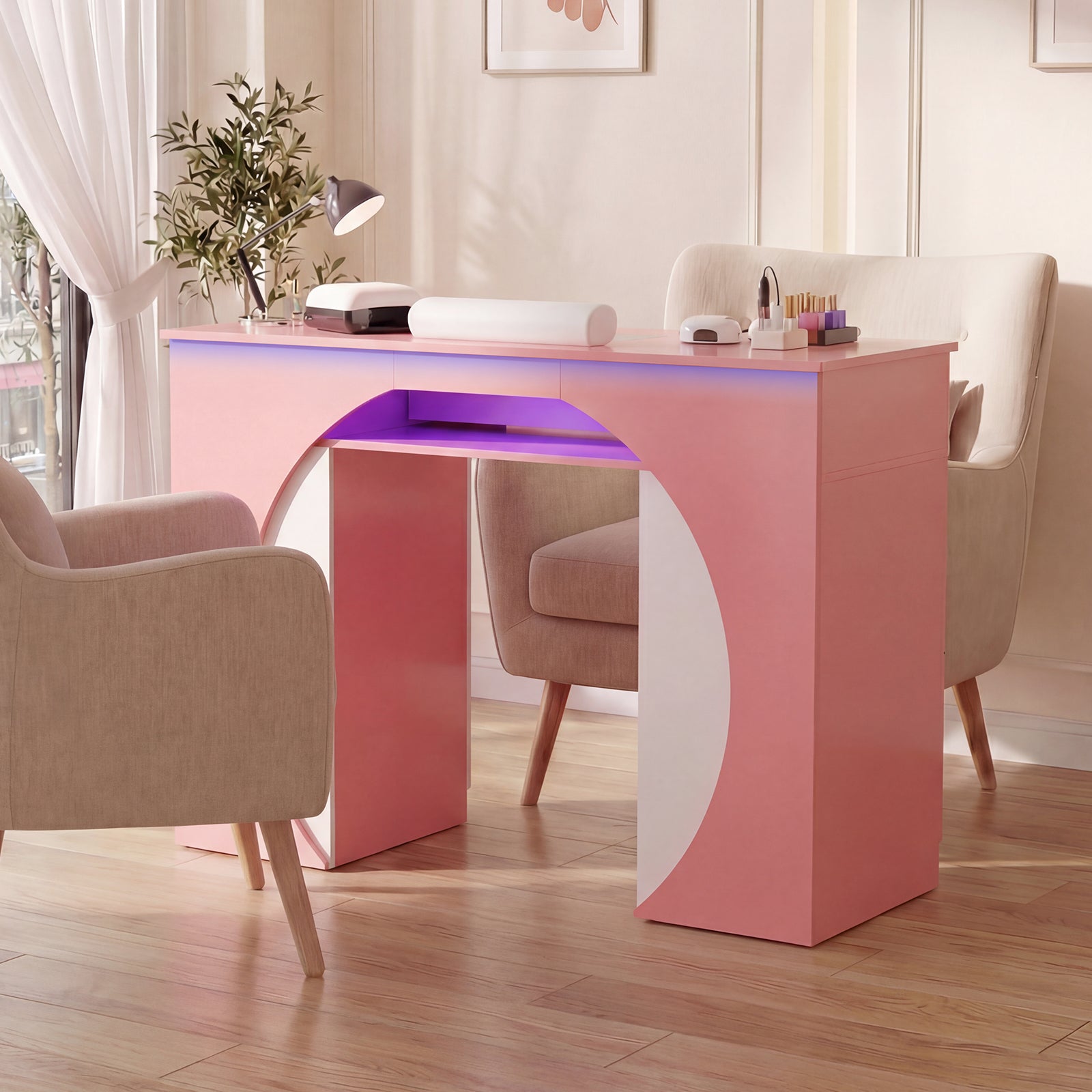 Modern pink desk with LED lighting in a room with chairs and decor.