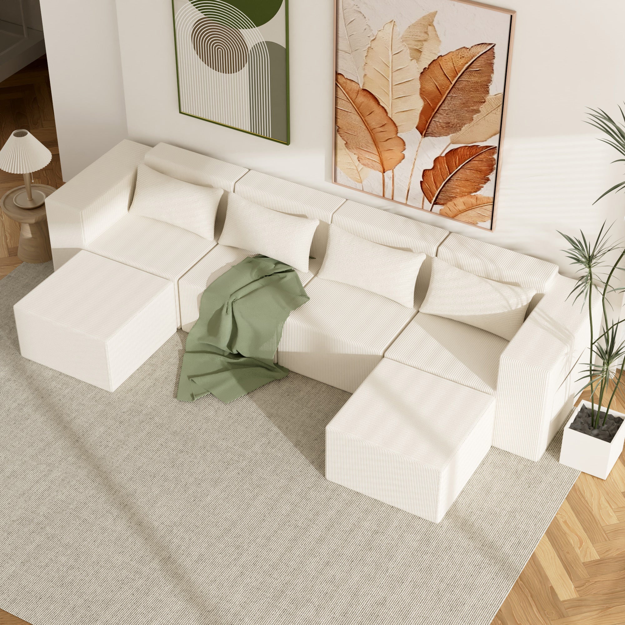 Modern white sectional sofa in a living room with decorative elements.
