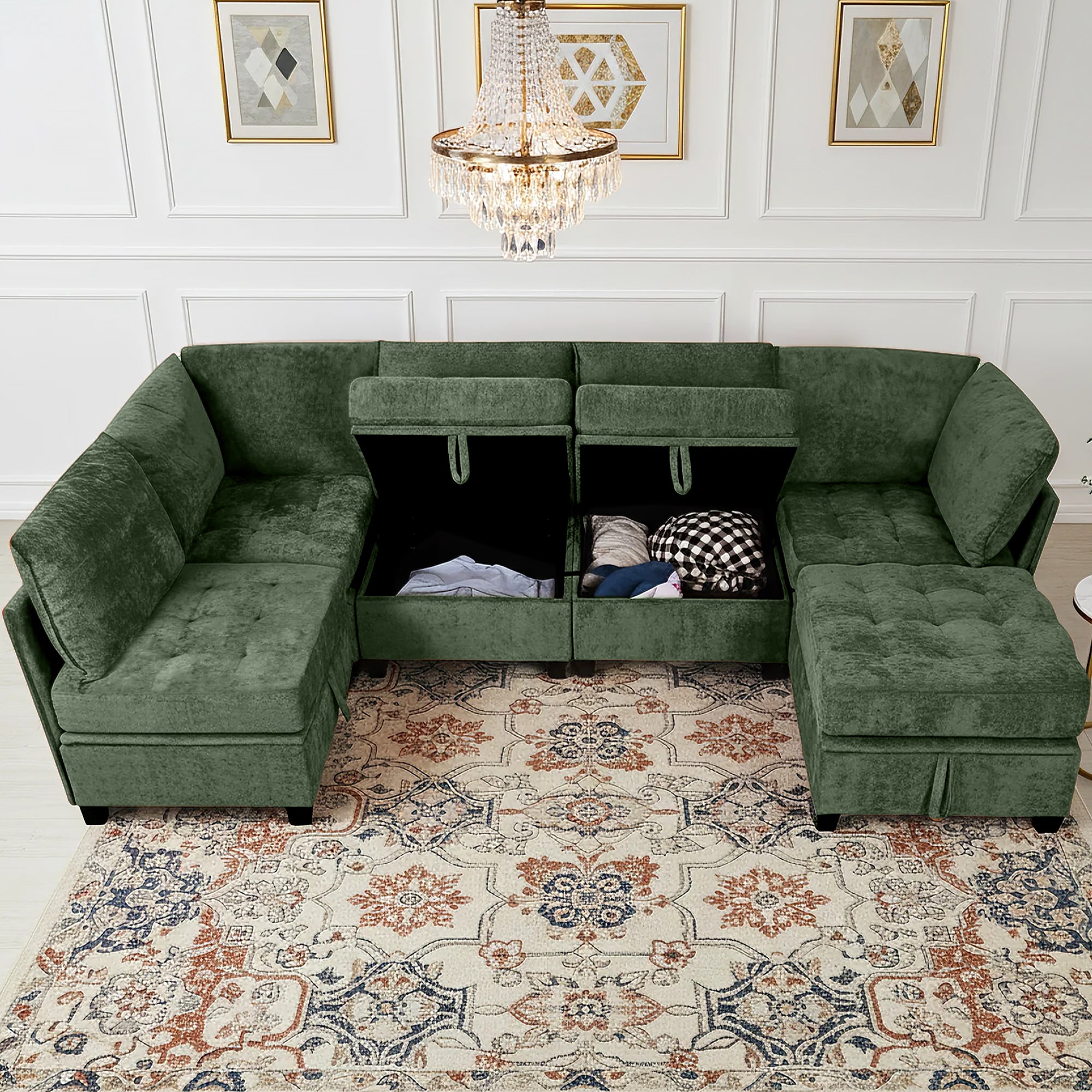 Green sectional sofa in a living room with decorative rug and chandelier.