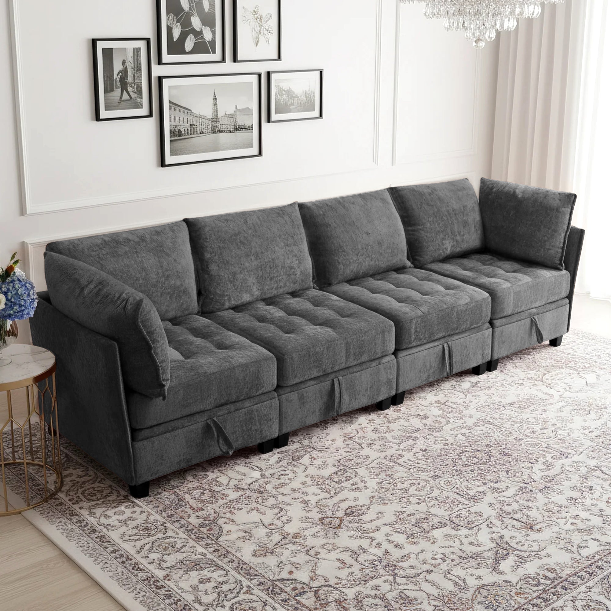 Gray sectional sofa in a living room setting with framed pictures on the wall.