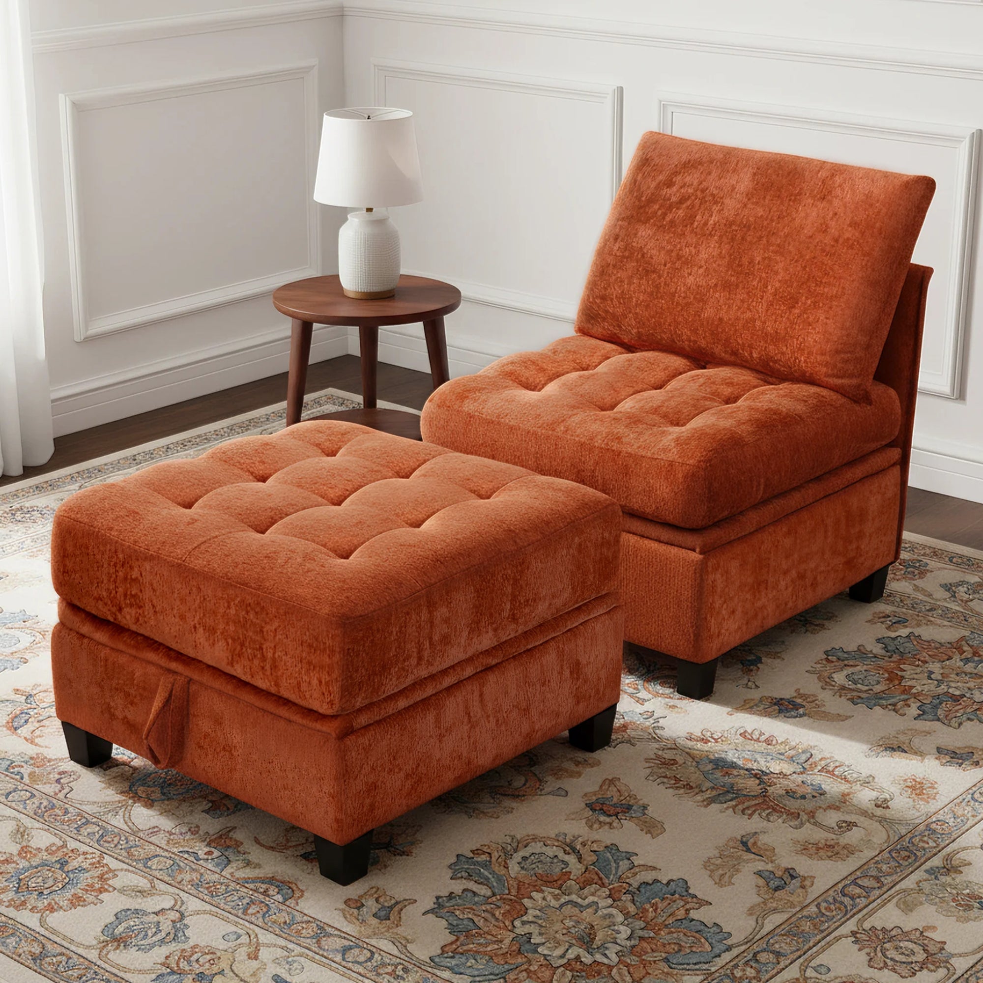 Orange upholstered chair and ottoman on a patterned rug with a lamp in the background.