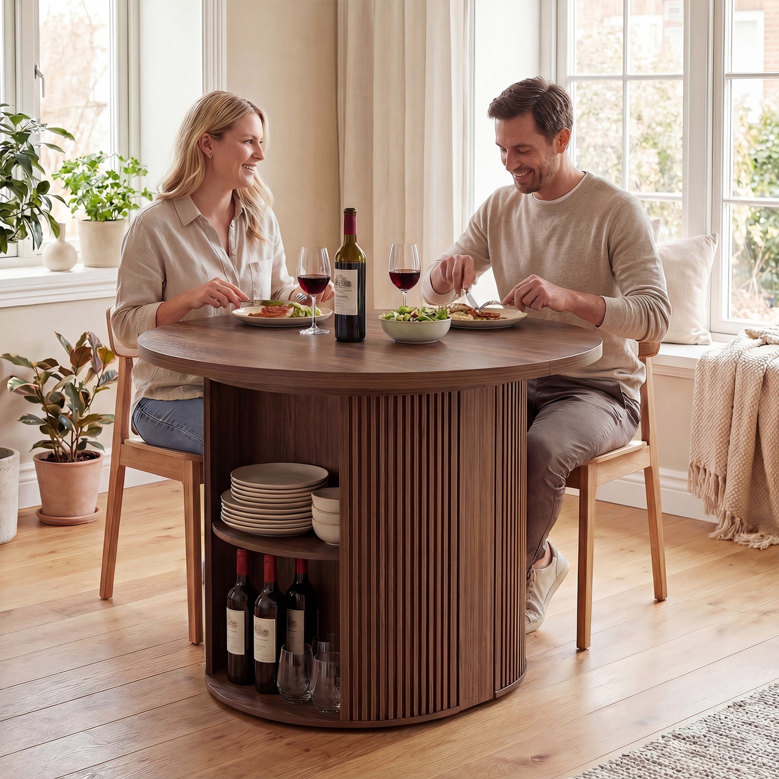 Couple enjoying a meal together at a wooden dining table with storage shelves.