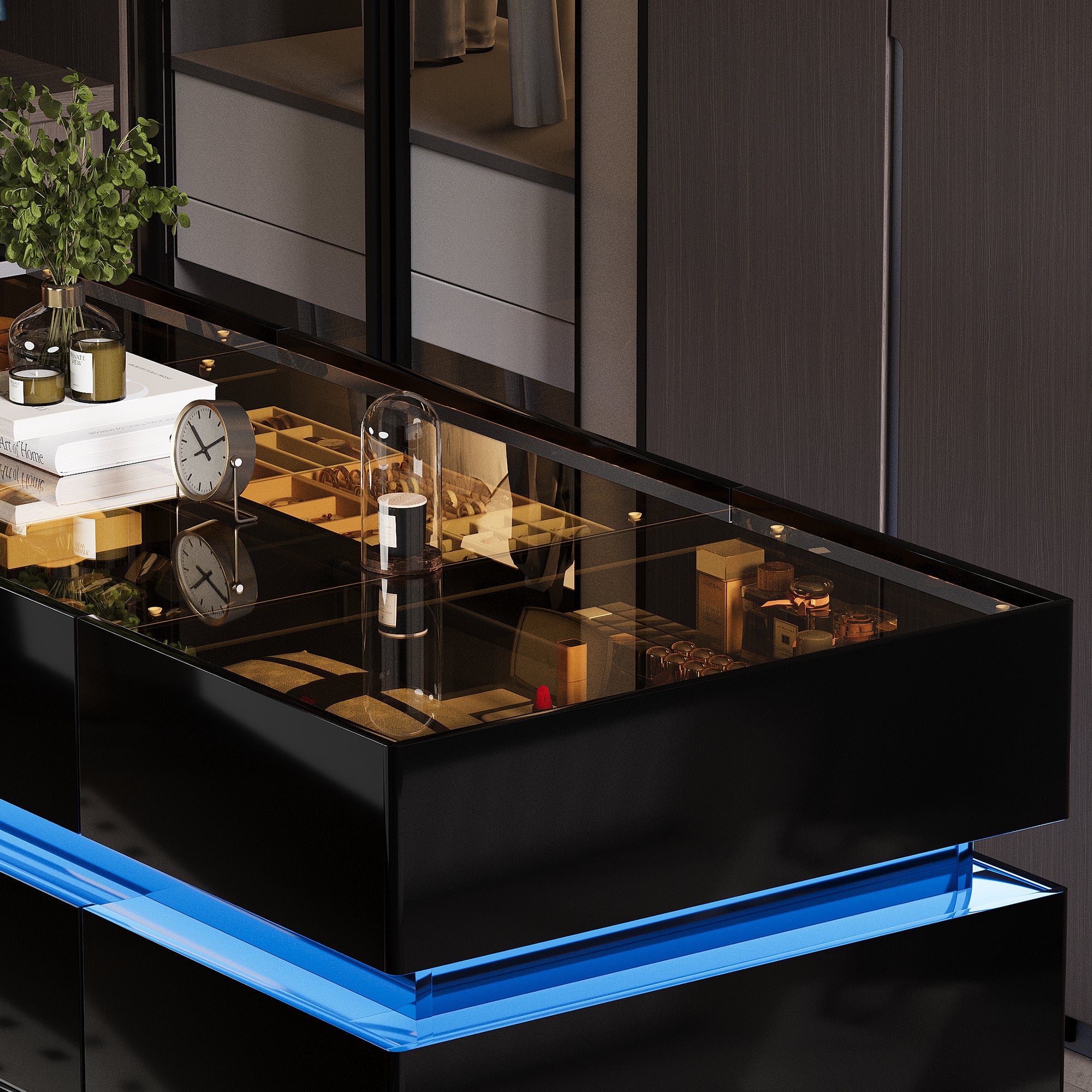 Modern black dresser with blue LED lighting and decorative items.