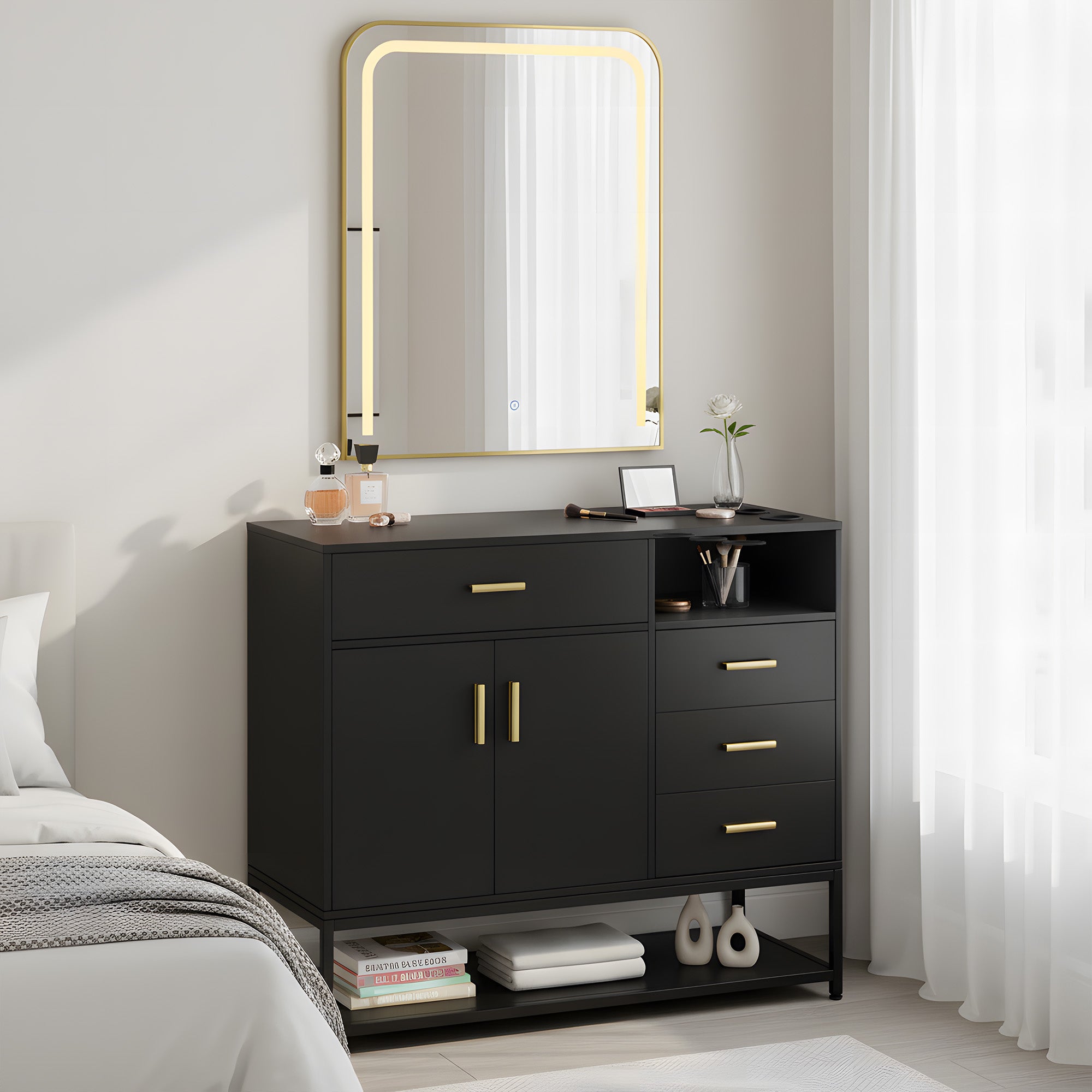 Black dresser with gold handles in a bedroom setting