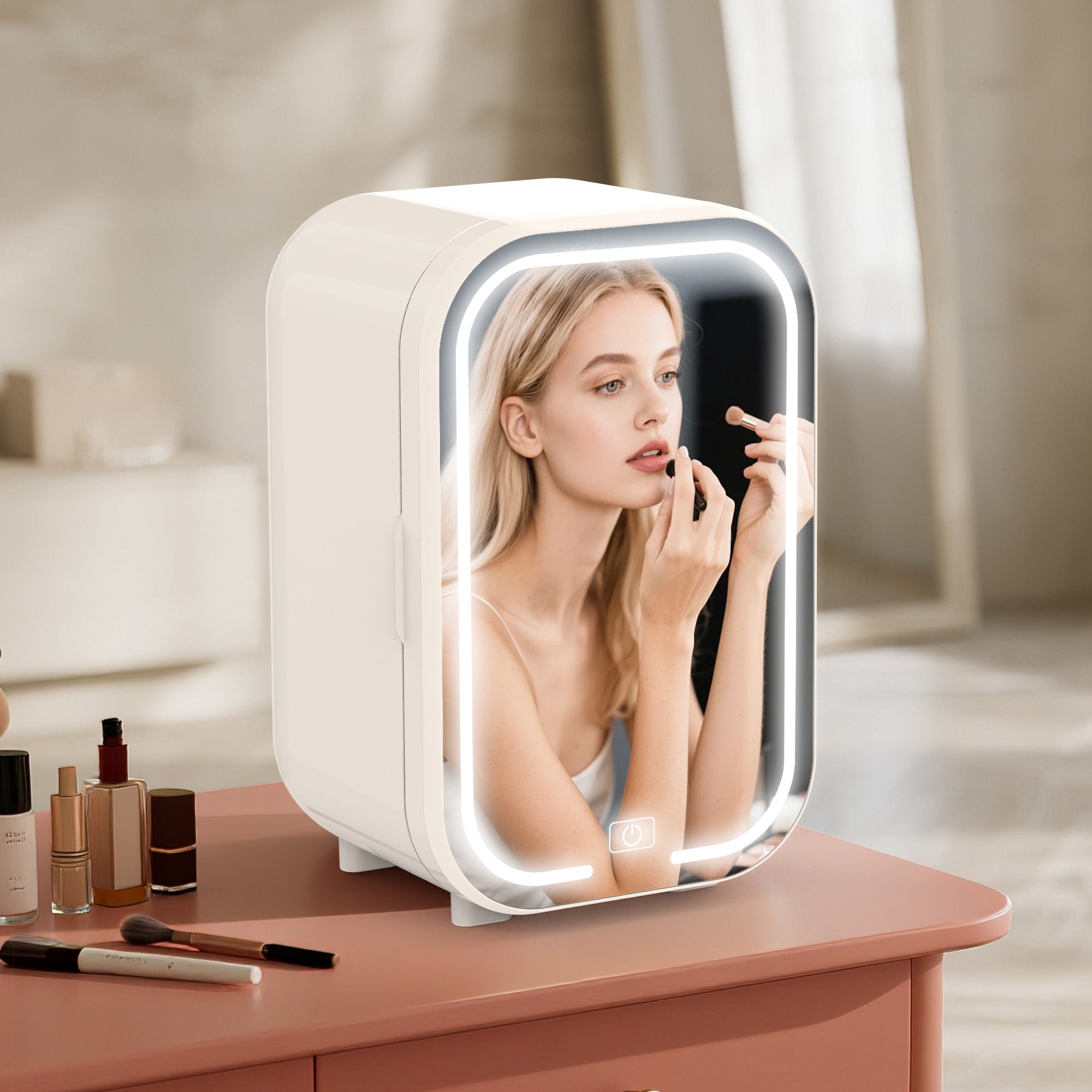 Woman applying lipstick in a illuminated makeup mirror on a vanity table.