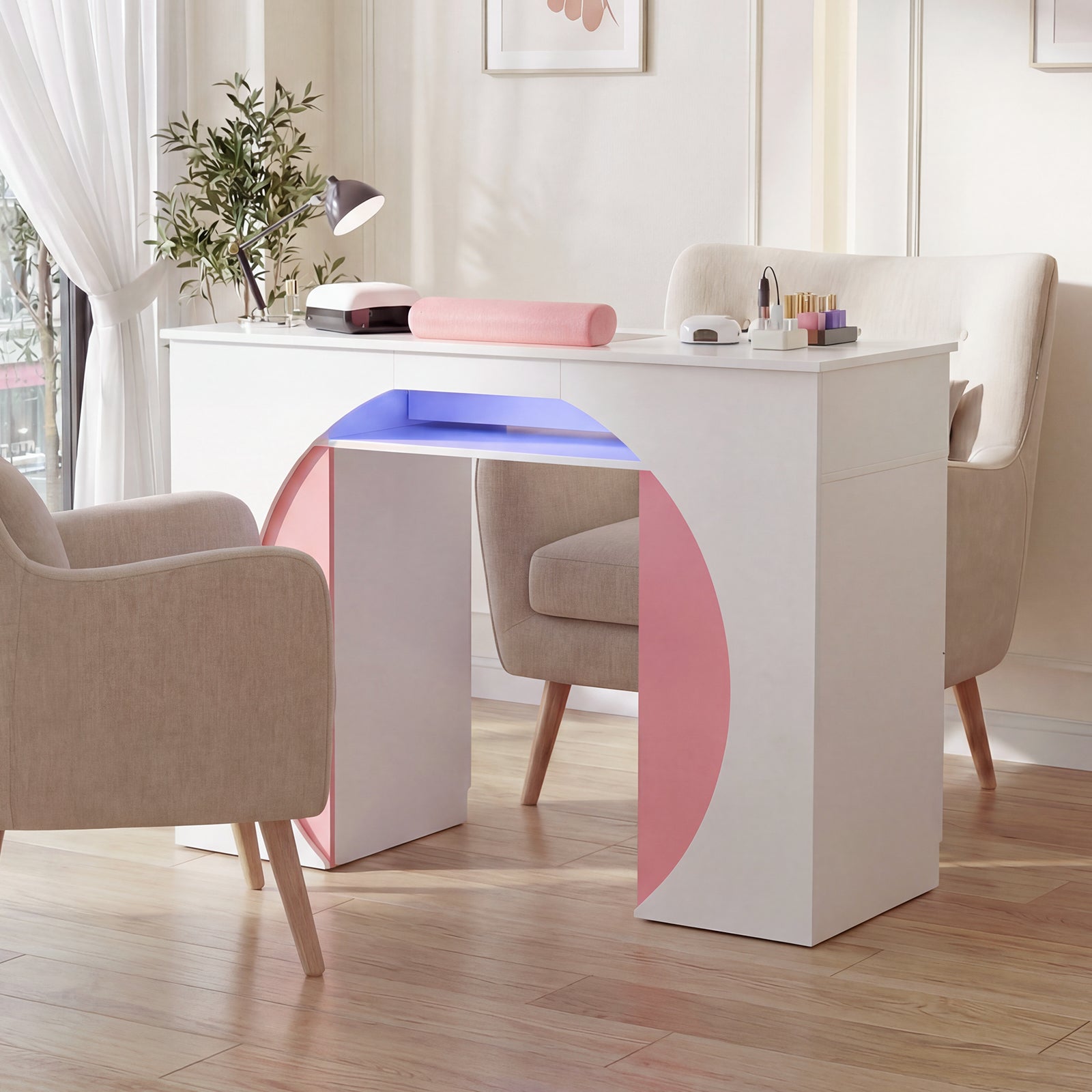 Modern white desk with pink and blue accents in a bright room