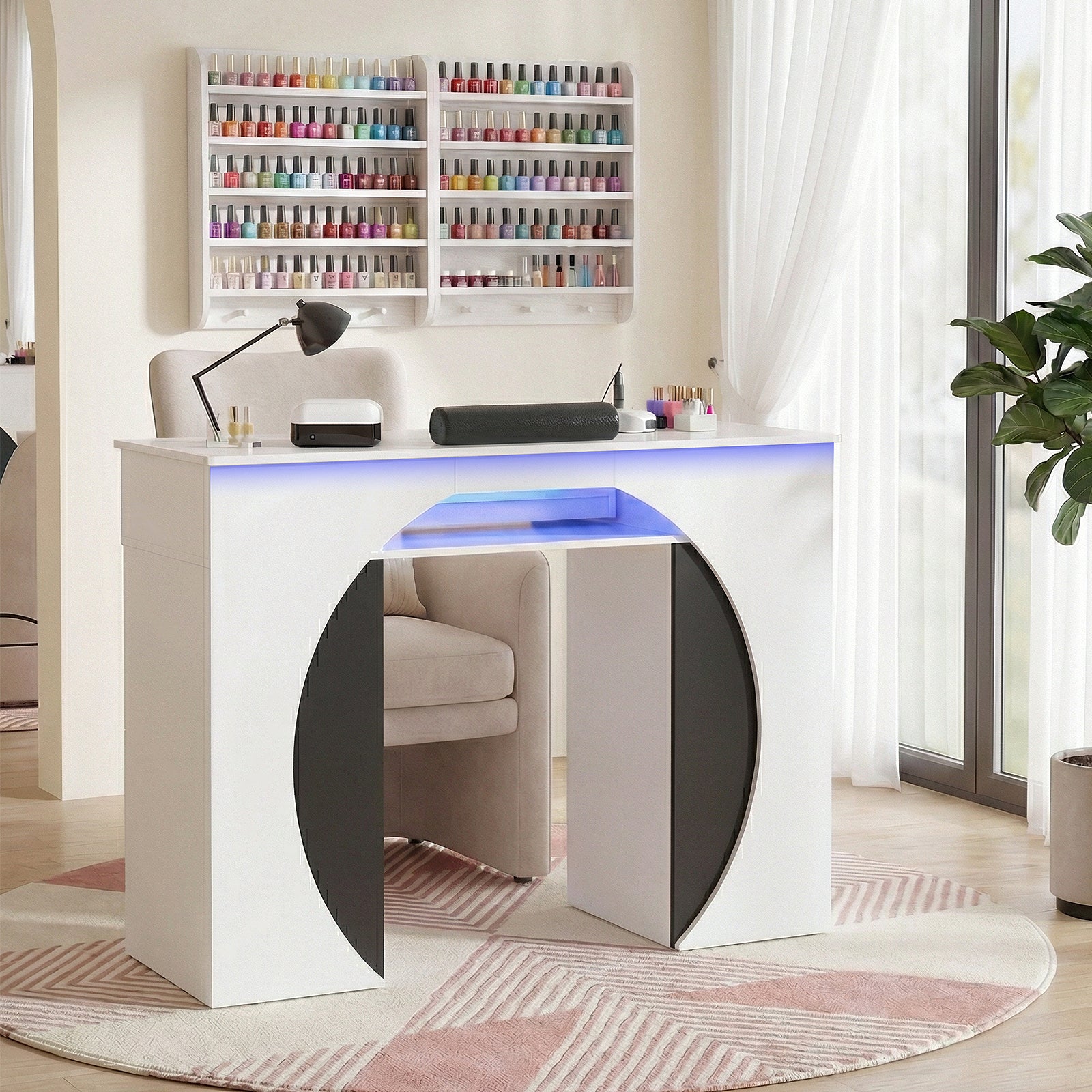 Modern white desk with blue LED lighting in a room with shelves and decor.