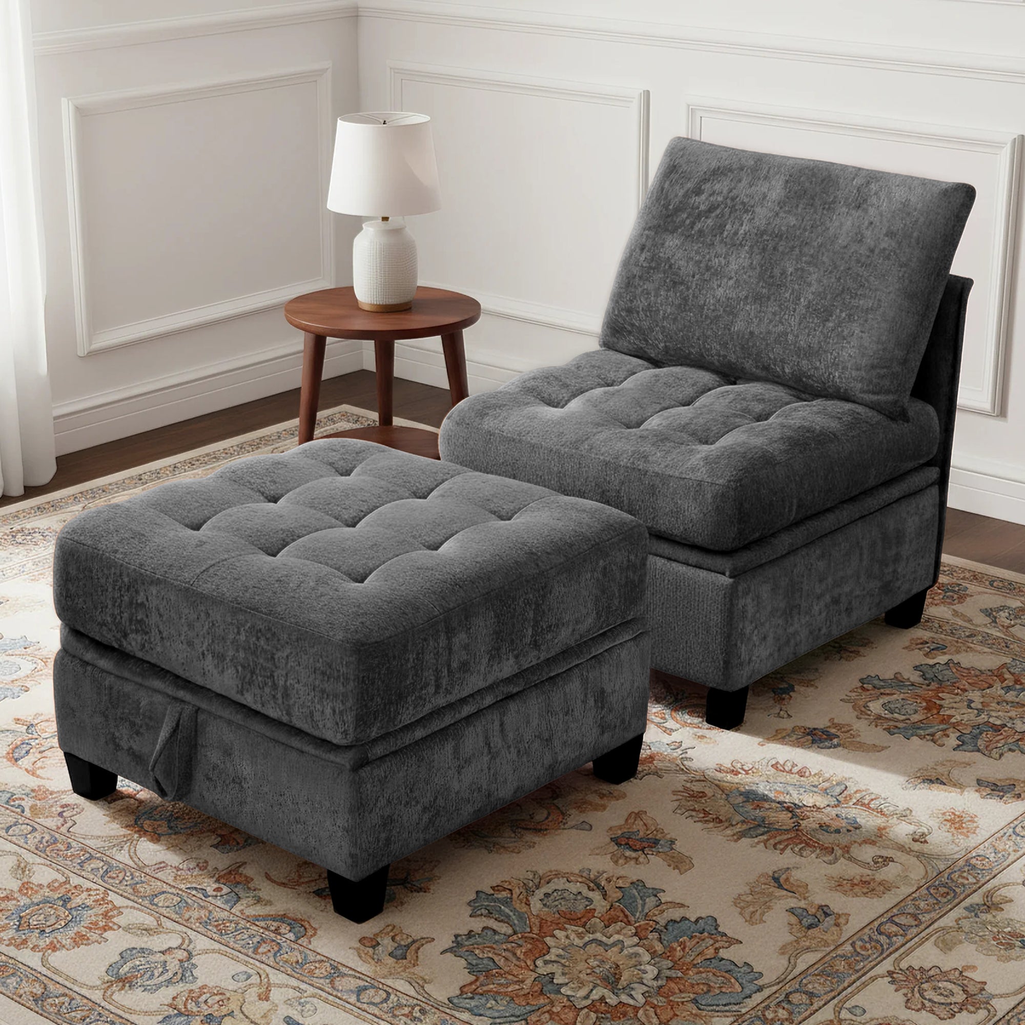 Gray upholstered chair and ottoman set in a room with a lamp and decorative rug.