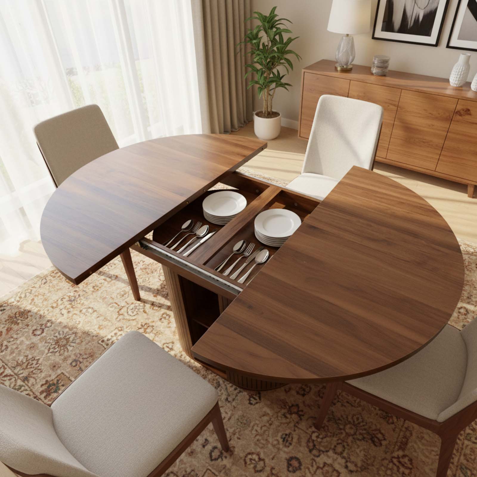 Round wooden dining table with extended leaf in a living room setting