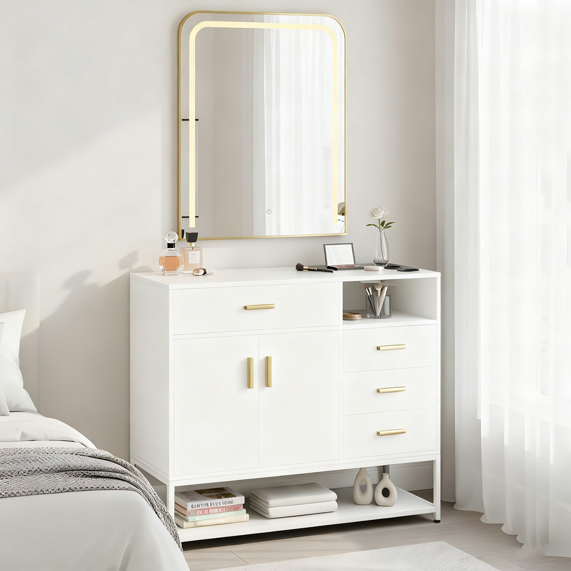 White dresser with gold accents and a mirror in a bedroom setting.