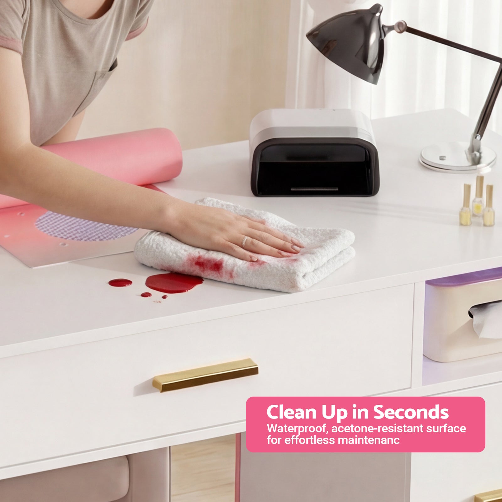 Person cleaning a desk with a red stain using a white cloth, with text about a waterproof and acetone-resistant surface.