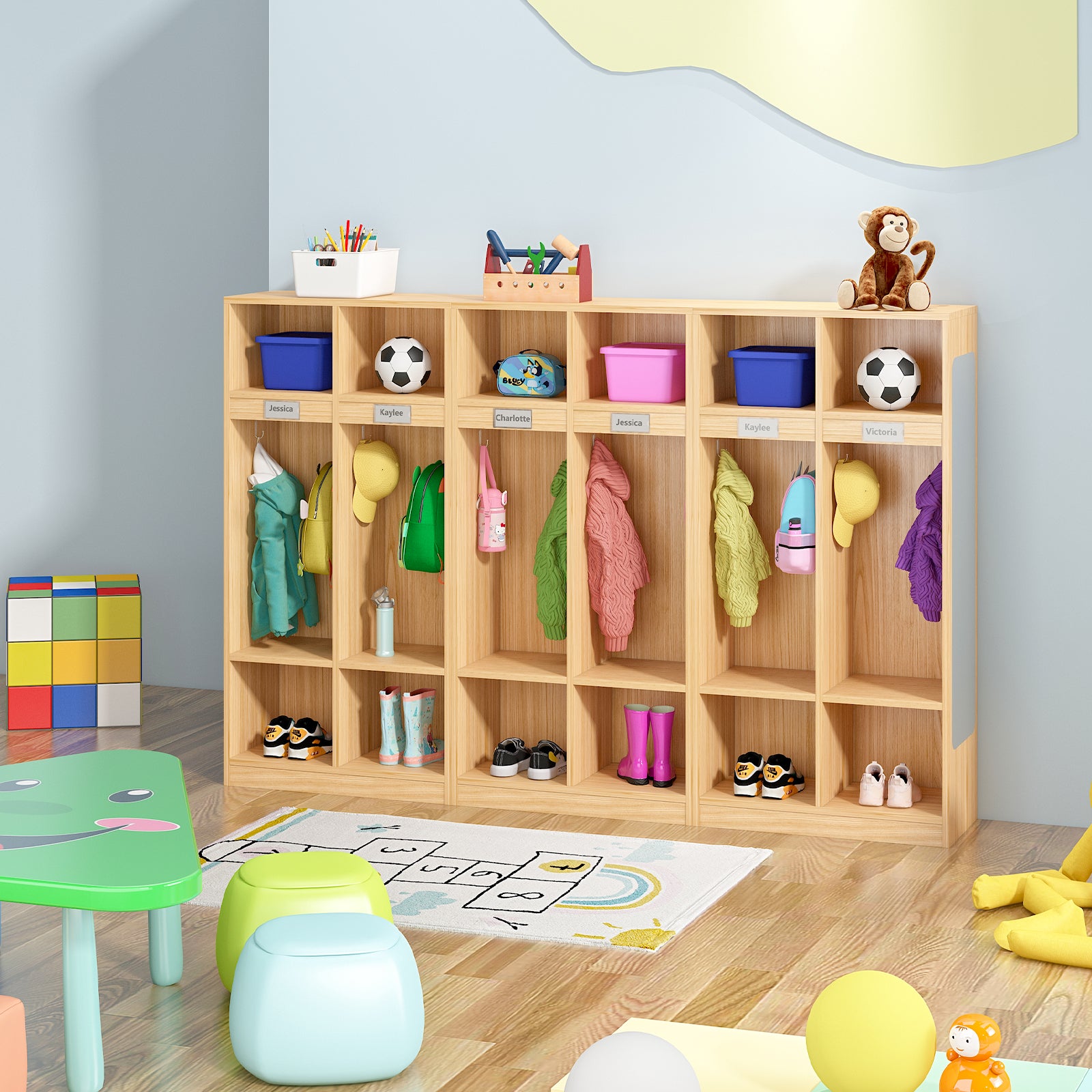 Children's playroom with wooden locker, colorful stools, and toys on a light blue wall.